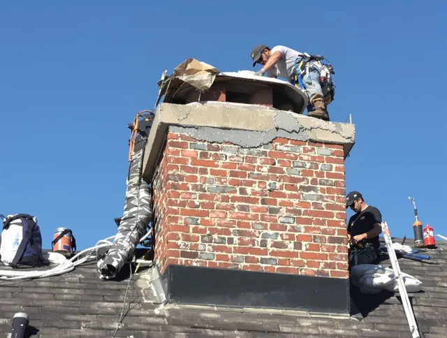 Pico Rivera Chimney Sweep installing a custom chimney crown in Pico Rivera, CA