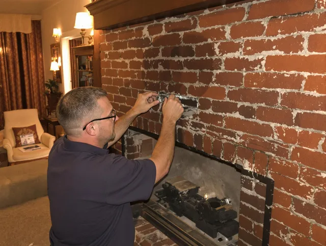 Pico Rivera Chimney Sweep expert fixing a fireplace in Pico Rivera, CA